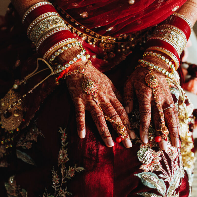 Authentic indian wedding bracelets and colored hands by henna