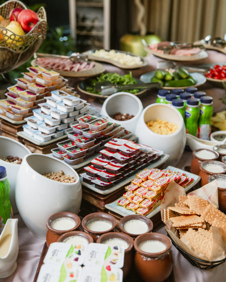 breakfast set with butter jams yogurts and cookies